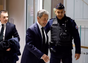 Former French President Nicolas Sarkozy leaves during a break in a hearing on the first day of his trial with twelve other defendants on charges of corruption and illegal financing of an election campaign related to alleged Libyan funding of his successful 2007 presidential bid, at the courthouse in Paris, France, January 6, 2025. REUTERS/Gonzalo Fuentes