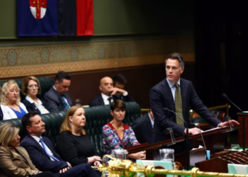 New South Wales Premier Chris Minns speaks during a condolence motion following the shooting at a Hanukkah event at Sydney's Bondi Beach, in the Legislative Assembly at Parliament House in Sydney, Australia, December 22, 2025.    Dominic Lorrimer/Pool via REUTERS