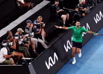 Serbia's Novak Djokovic reacts on a point to Netherlands' Botic van de Zandschulp during their men's singles match on day seven of the Australian Open tennis tournament in Melbourne on January 24, 2026. (Photo by DAVID GRAY / AFP) / -- IMAGE RESTRICTED TO EDITORIAL USE - STRICTLY NO COMMERCIAL USE --