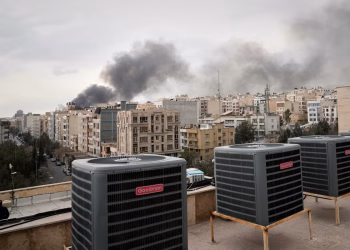 A plume of smoke rises after a strike in Tehran, Iran, Tuesday, March 2, 2026. (AP Photo/Vahid Salemi)